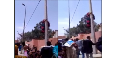 شاهد: لحظة تسلق سيدة مغربية &ldquo;حامل&rdquo; عامودًا كهربائيًا لتنتحر !