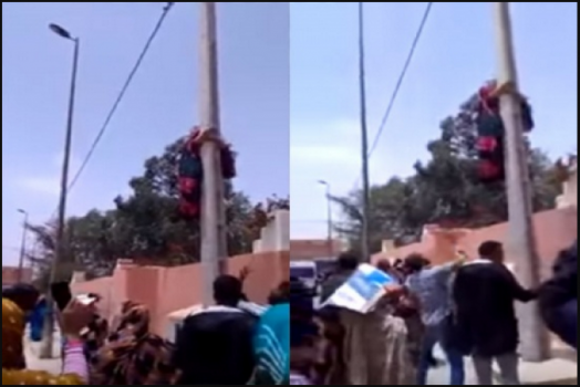 شاهد: لحظة تسلق سيدة مغربية &ldquo;حامل&rdquo; عامودًا كهربائيًا لتنتحر !
